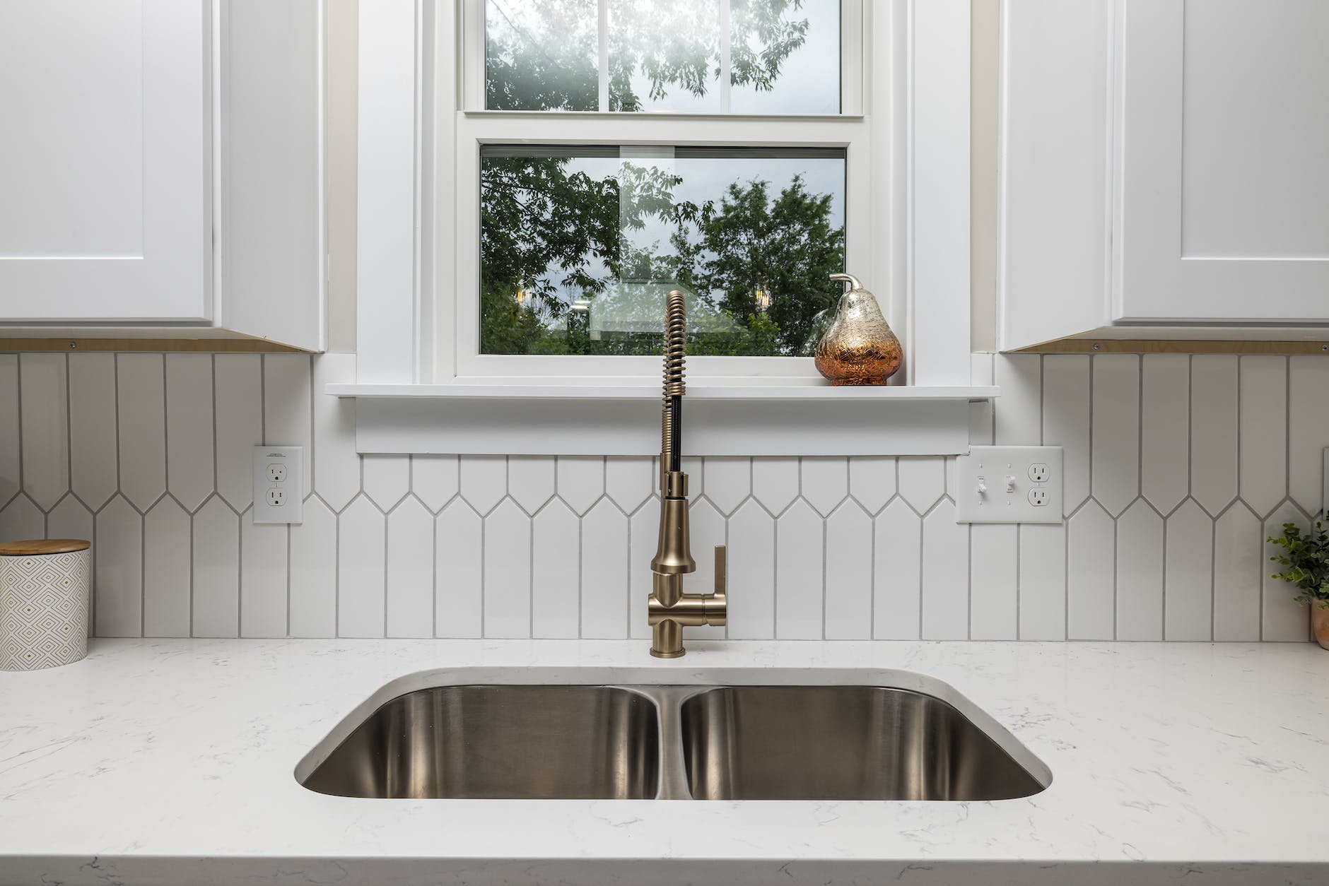 stainless steel sink under a window